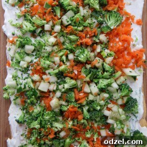 Beautifully presented veggie bars on a wooden board, garnished with fresh herbs, ready for serving.