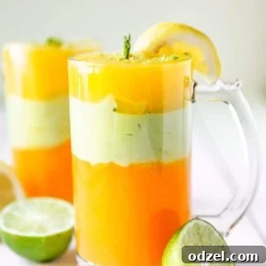 Two tall glasses filled with Ethiopian Spris, garnished with limes.
