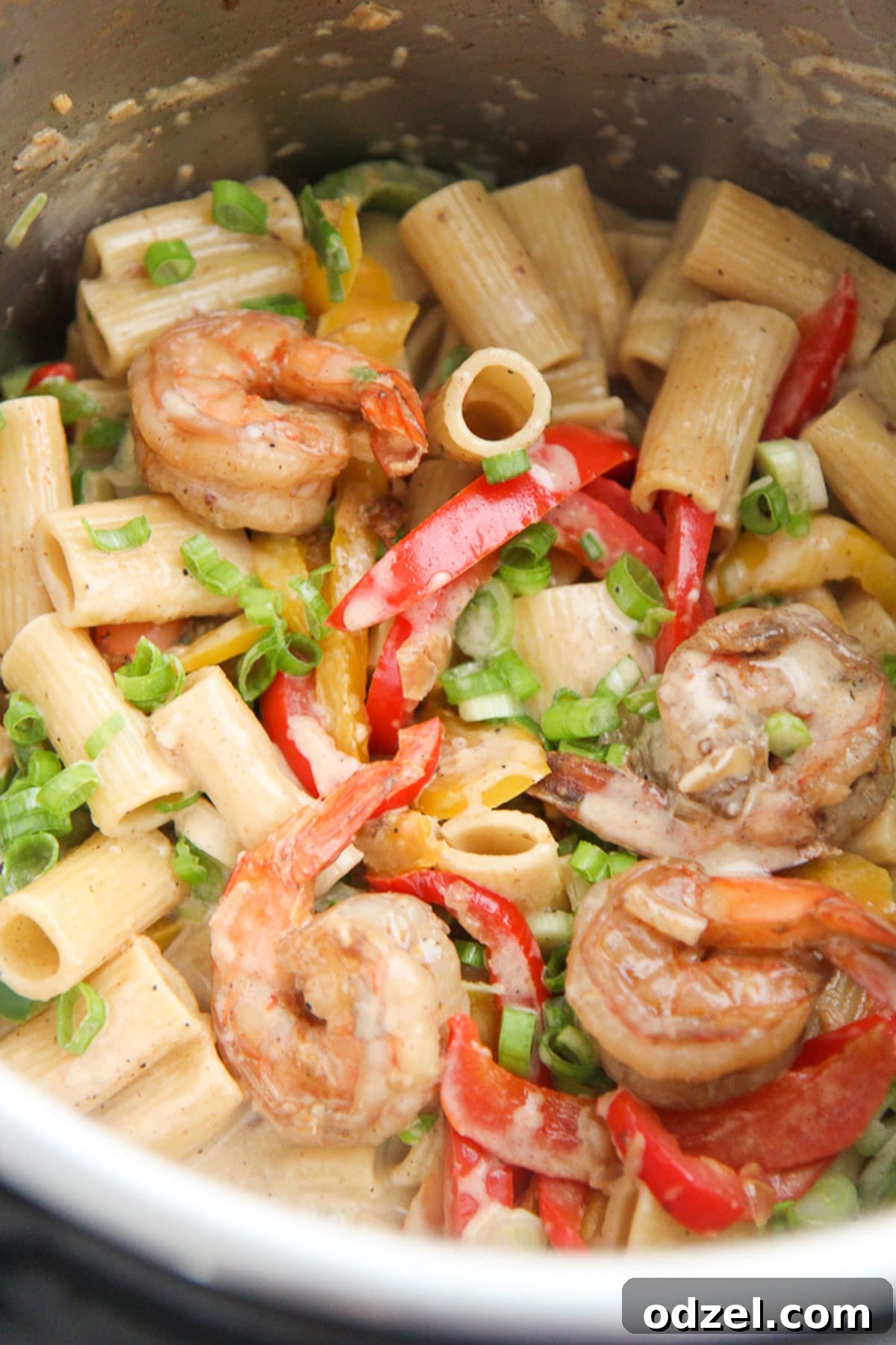 Creamy Instant Pot Rasta Pasta 2 Vibrant Instant Pot Rasta Pasta with Shrimp in a deep bowl, garnished with fresh herbs.
