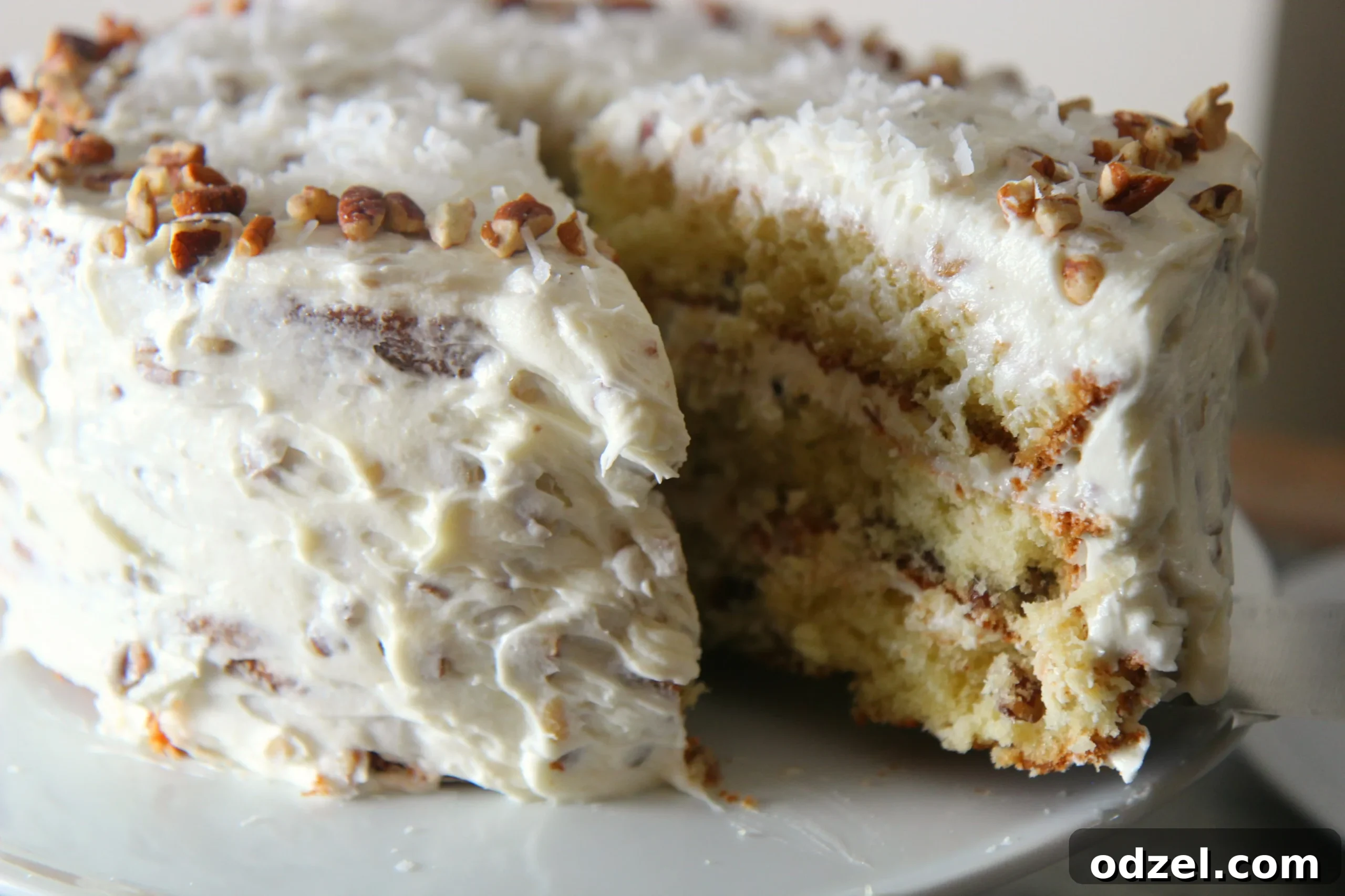 Beautiful layers of moist Italian cream cake and generous cream cheese frosting, garnished with nuts.