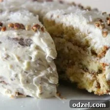 A perfectly baked Italian Cream Cake ready to be enjoyed, topped with fluffy cream cheese frosting.