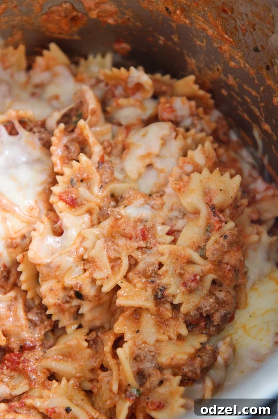Instant Pot Lasagna Shortcut 4 Instant Pot Lazy Lasagna still in the Instant Pot liner, with melted cheese and fresh herbs.