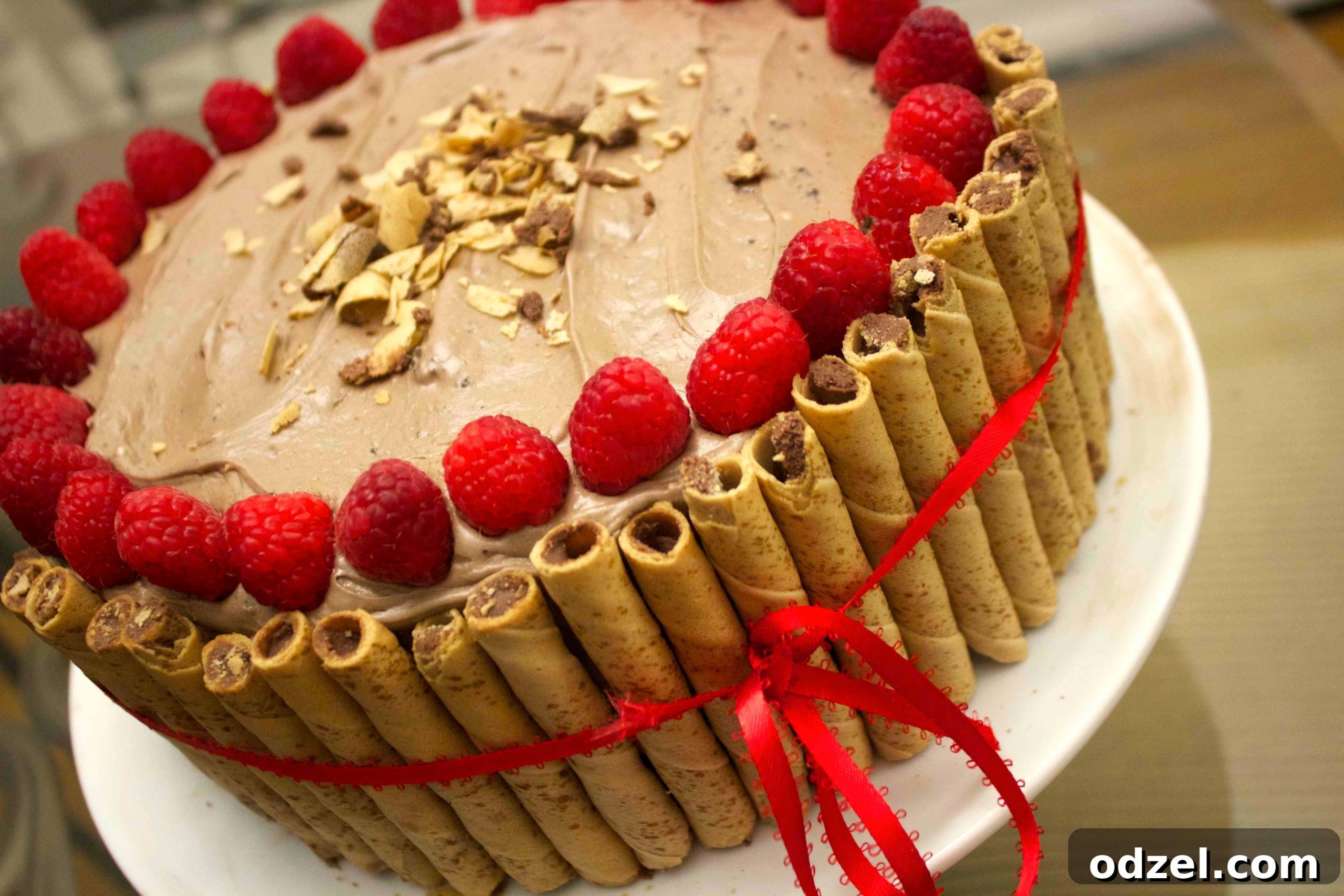 Decadent Nutella Dream Cake 3 Hazelnut cookie rolls around this Nutella cake gives this deliciously moist cake a little extra crunch