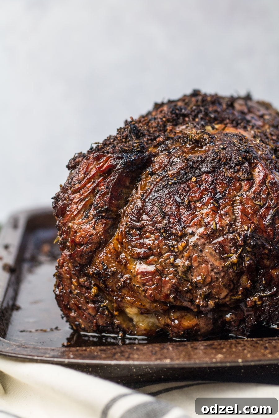 Juicy Prime Rib Masterpiece 5 Close-up view of perfectly cooked medium-rare prime rib, showcasing its tender texture.