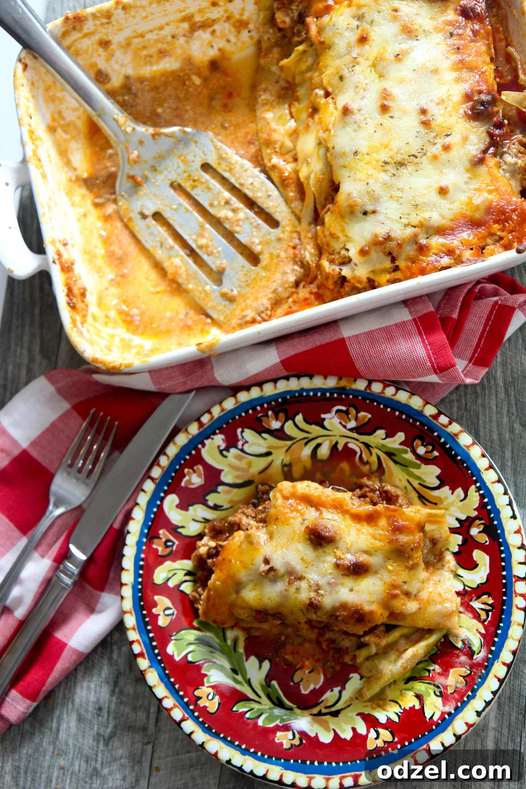 Keto Cabbage Lasagna Delight 4 A close-up shot of a cheesy cabbage lasagna and a small plate on the side with a perfectly cut slice of lasagna.