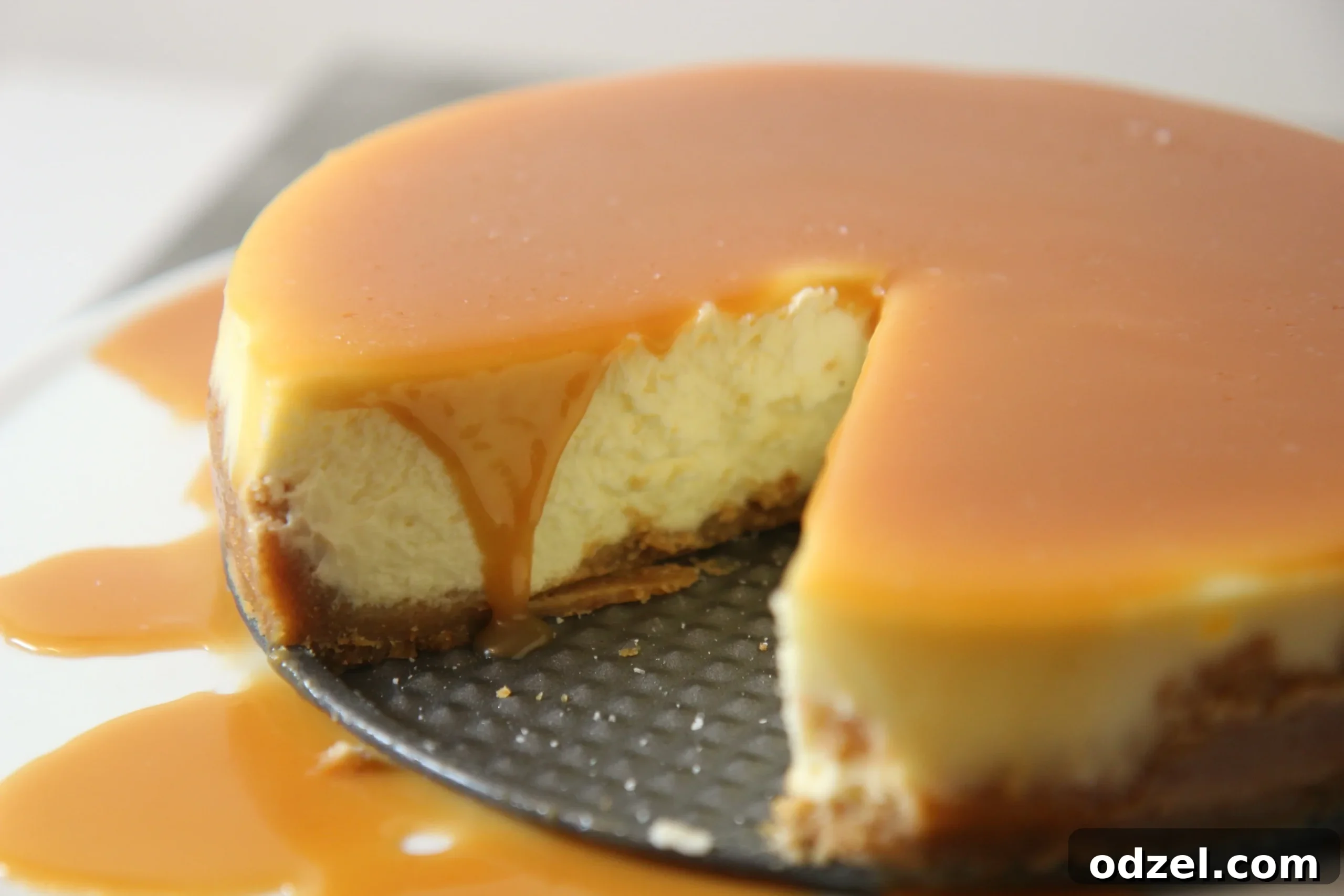 Decadent Sea Salt Caramel Cheesecake 7 Close-up of salted caramel cheesecake, highlighting the light salt sprinkle to enhance sweetness.