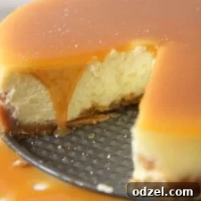 Decadent Sea Salt Caramel Cheesecake 8 A round salted caramel cheesecake with a swirl of caramel on top.
