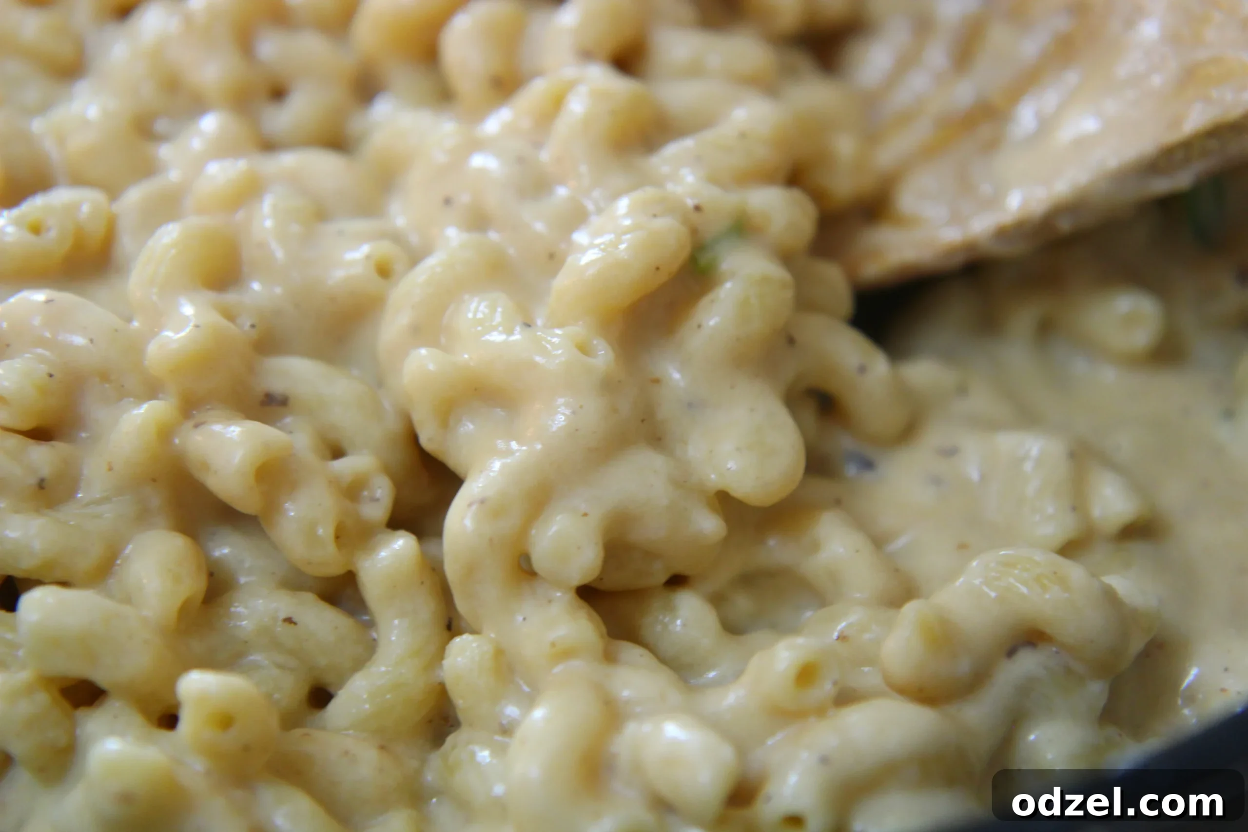 Epic Mac and Cheese 3 Super creamy bechamel sauce for the ultimate mac and cheese, showcasing its rich texture before baking.
