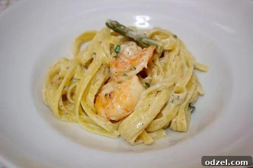 Zesty Garlic Shrimp Fettuccine 3 A close-up of Garlic Shrimp Fettuccine Alfredo, showcasing the creamy sauce, plump shrimp, and fresh herbs.