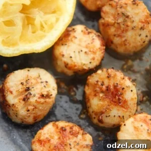 air fryer scallops with a lemon on the side.