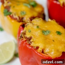 Close-up of baked taco stuffed peppers topped with cheese