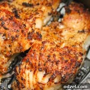 Two cooked Chilean sea bass fillets with a honey glaze, ready to serve.