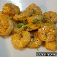 A close-up of Shrimp Remoulade on a plate, showcasing the rich sauce and fresh ingredients.