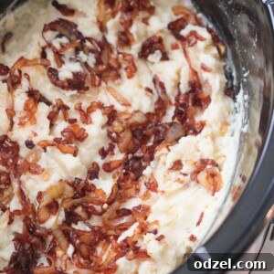 Crockpot mashed potatoes with caramelized onions.