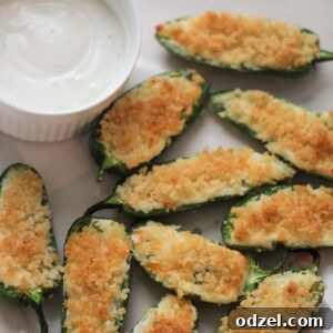 Air fryer jalapeno poppers with a side of blue cheese dressing.