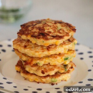 Golden Corn Fritters 2 stack of golden corn fritters on a plate