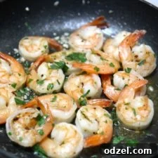 Buttery garlic shrimp in a pan, ready to serve.