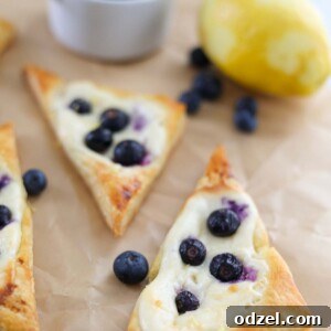 baked lemon blueberry danish on parchment paper.