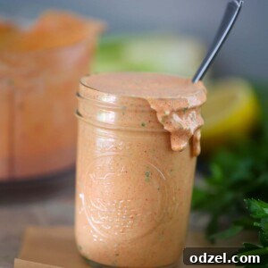 remoulade sauce in a mason jar with a spoon.