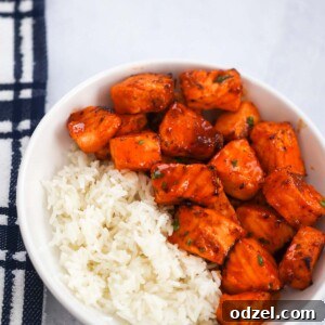 Hot honey salmon bites with white rice on the side.