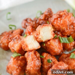 honey boneless bbq wings with scallions on a green plate