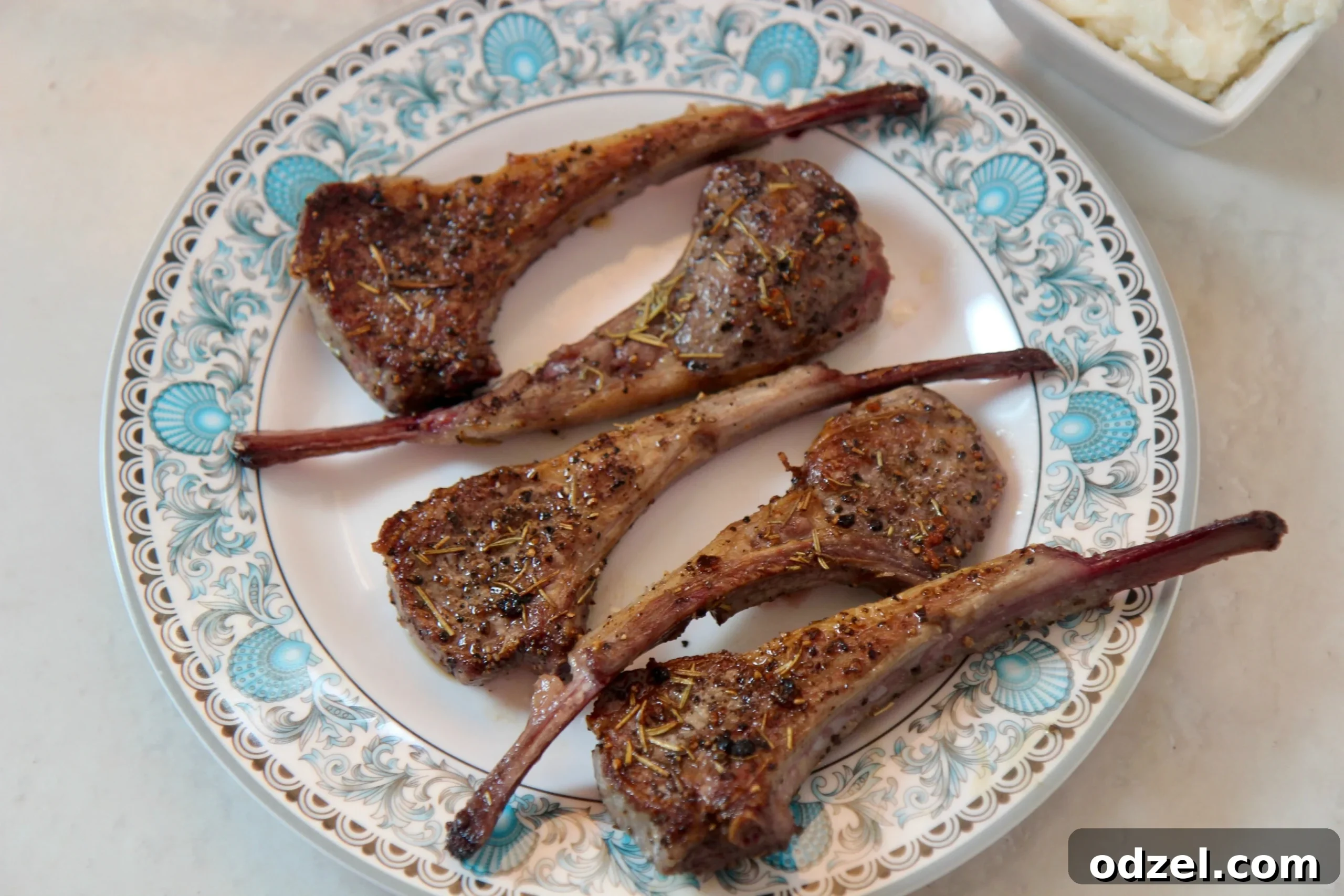Aromatic Rosemary Garlic Lamb Chops 4 Close-up of golden-brown cooked lamb chops, glistening with pan juices and ready to be served