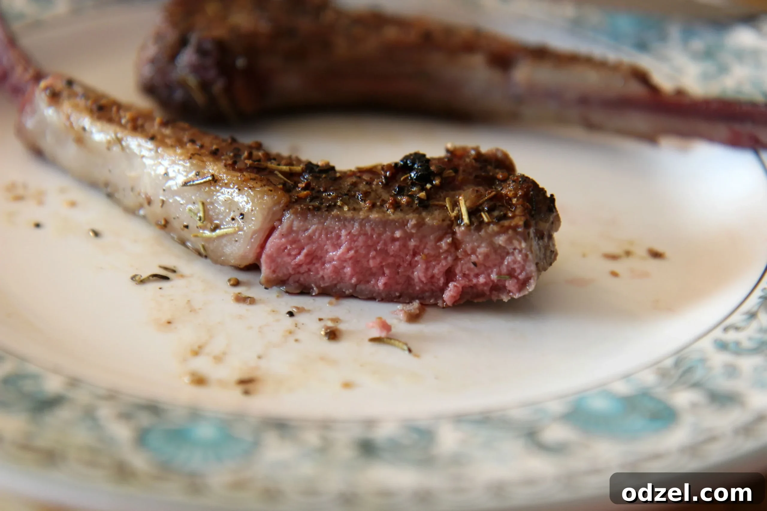 Aromatic Rosemary Garlic Lamb Chops 5 Succulent medium-rare lamb chops, showcasing their juicy pink interior and perfect sear