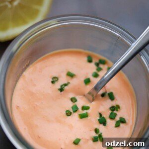 Homemade Bang Bang Sauce in a glass jar.
