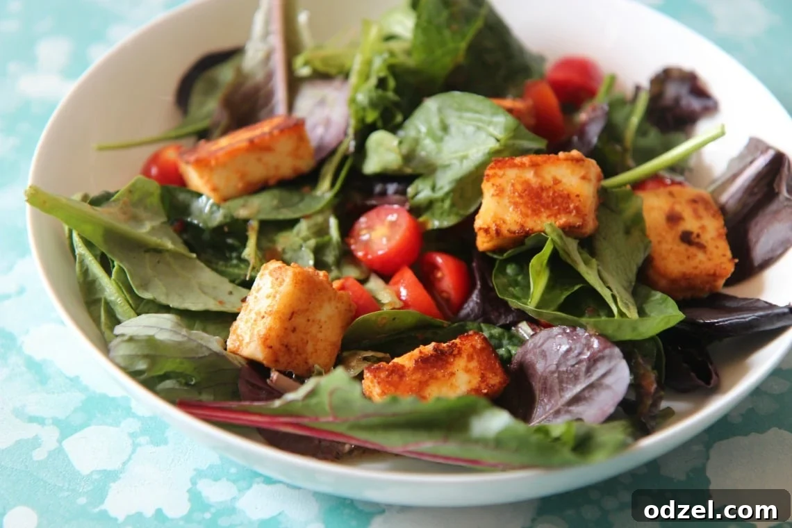 Fresh Paneer Power Salad 5 Paneer and tomato salad garnished with fresh herbs