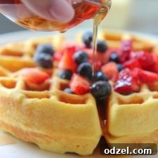 Keto waffles with syrup and fruit