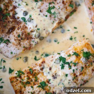 creamy mahi mahi fillets in a skillet.