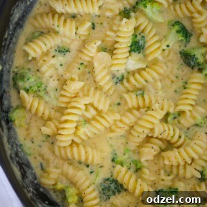 broccoli cheddar pasta in a skillet.
