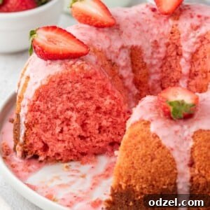 Luscious Strawberry Bundt 2 Strawberry bundt cake on a white plate.