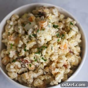 creamy bacon ranch pasta salad in a white bowl.