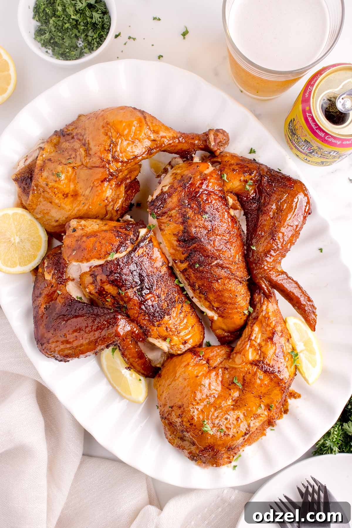 Cooked chicken pieces on a white plate, ready to be enjoyed.