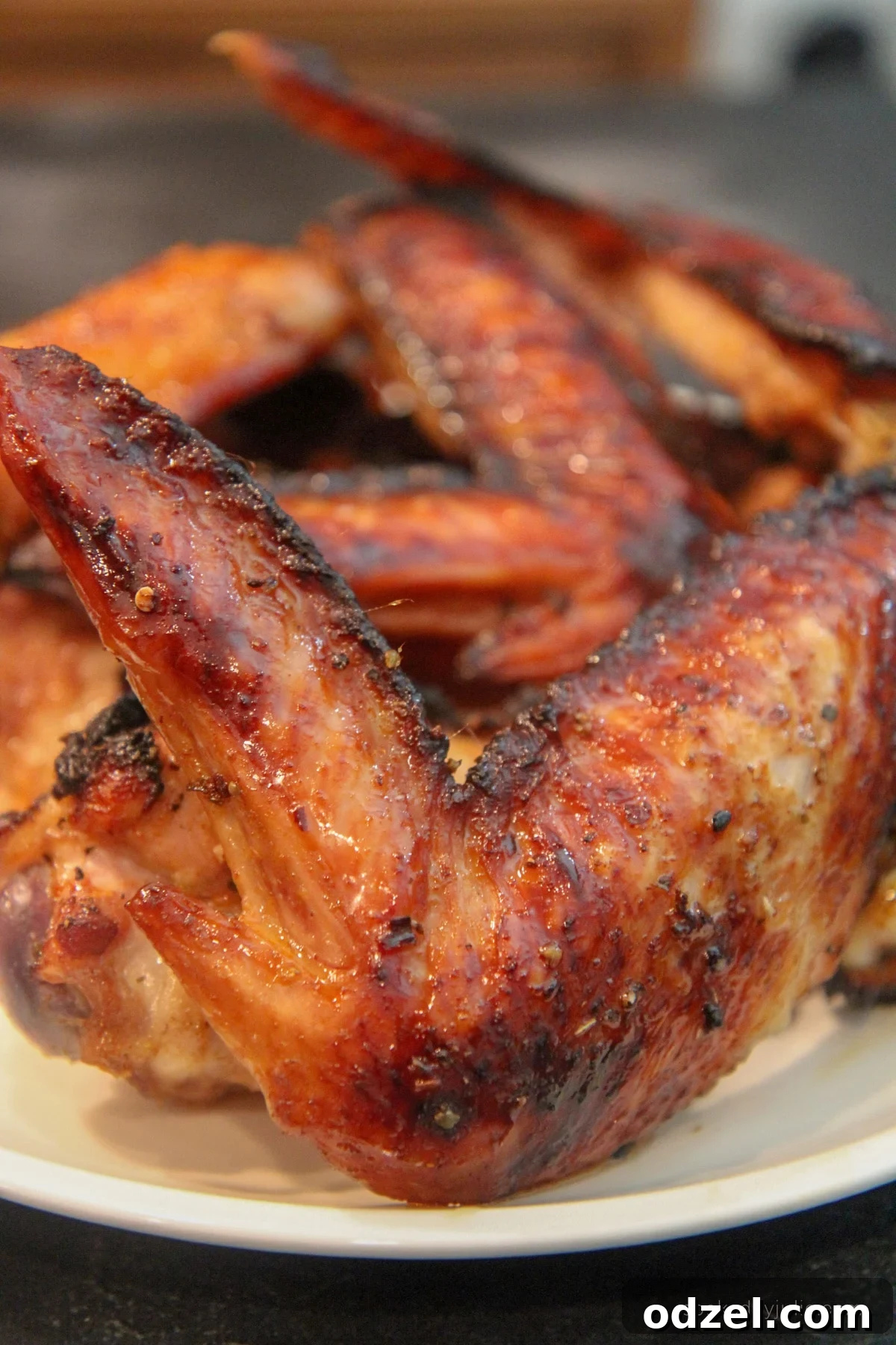 Close-up of baked honey turkey wings showing the sticky glaze and juicy texture.