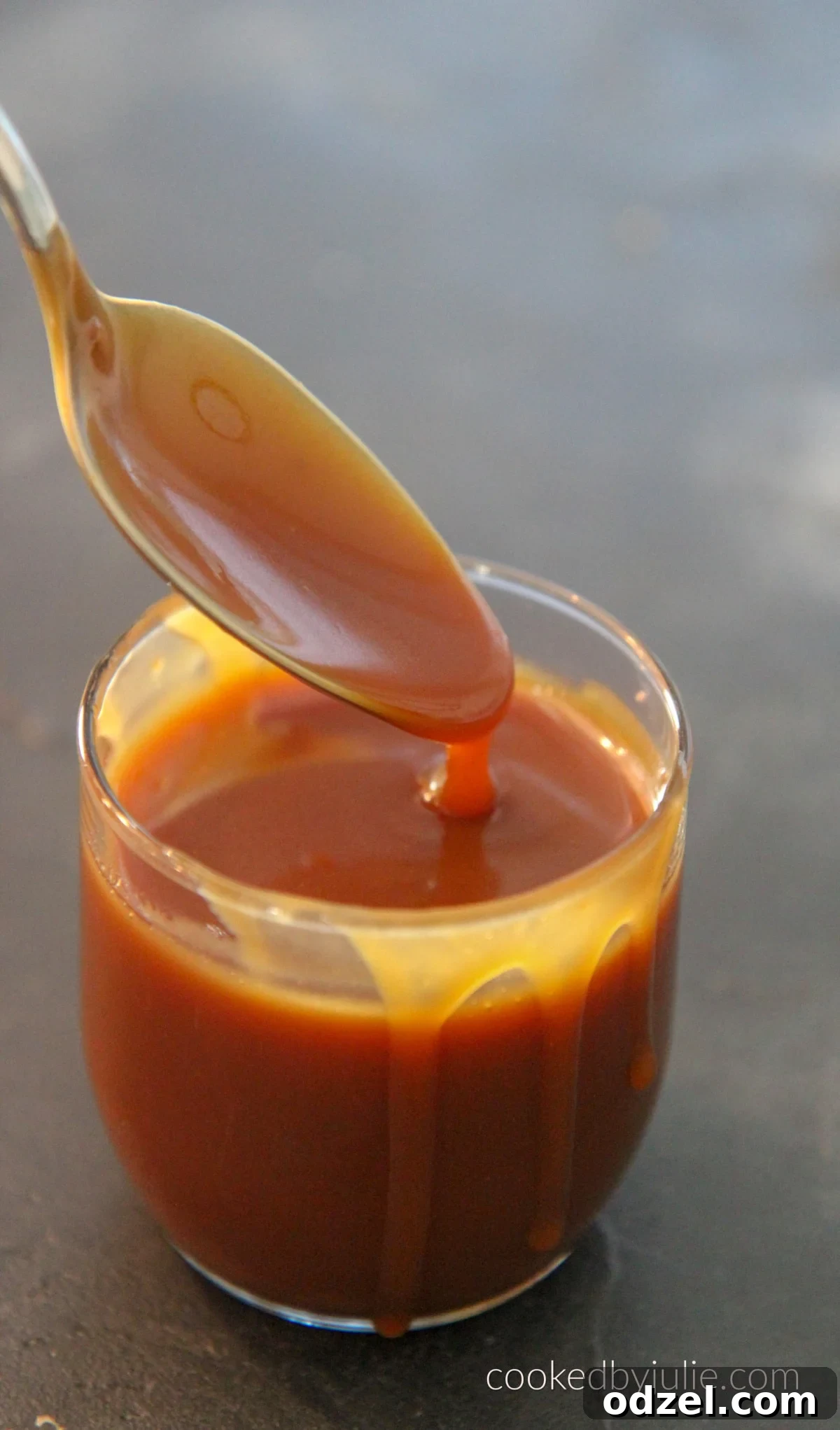 Velvety Smooth Caramel Sauce from Scratch 2 Delicious homemade caramel sauce in a jar, ready to be enjoyed with apples or drizzled over desserts.