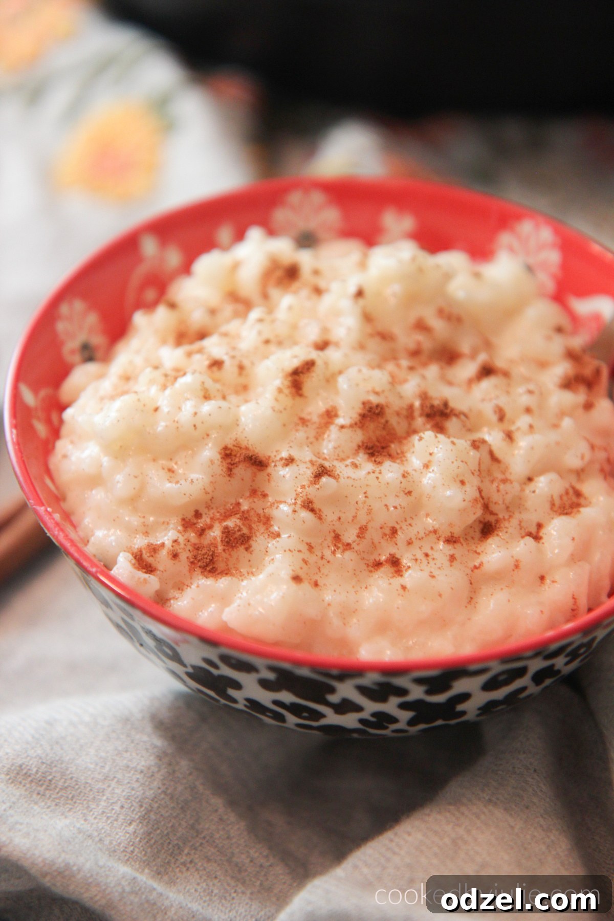 Quick and Creamy Instant Pot Rice Pudding 2 Creamy Instant Pot rice pudding (Arroz con Leche) in a small bowl, garnished with cinnamon.