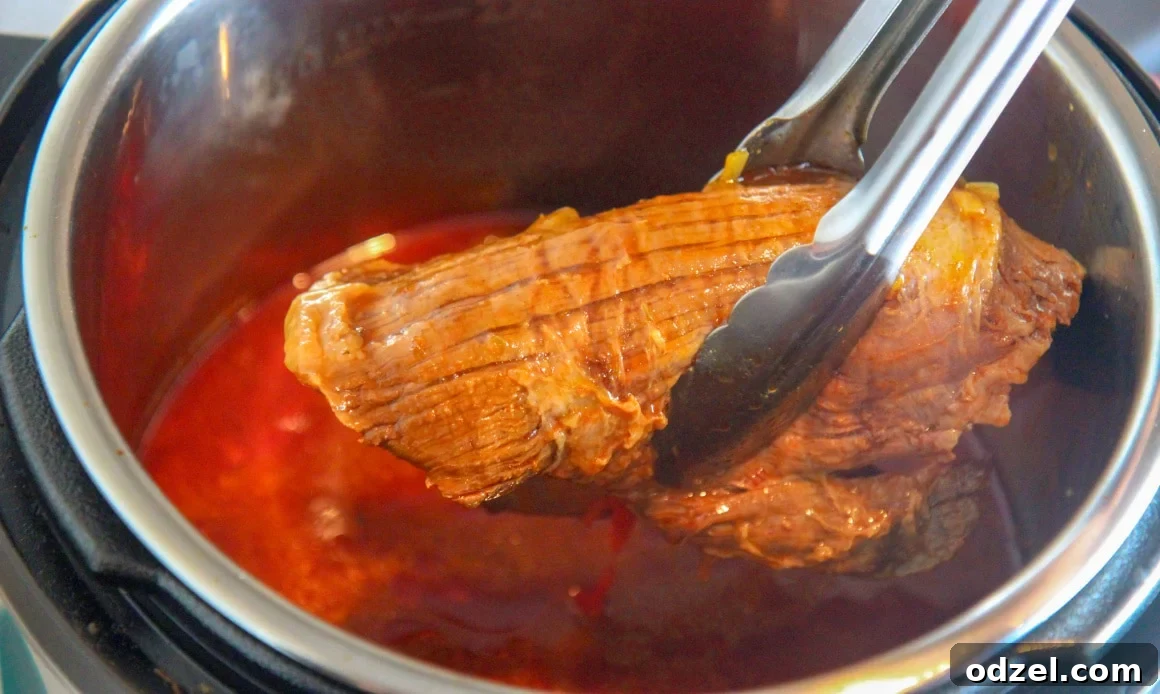 Two pounds of raw boneless flank steak, ready to be prepared for the Ropa Vieja recipe.