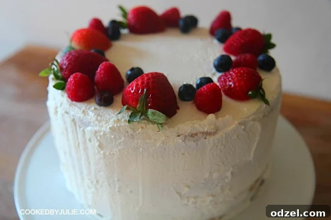 Summer Berry Symphony Cake 2 Triple layer triple berry cake with light vanilla frosting topped with fresh summer berries