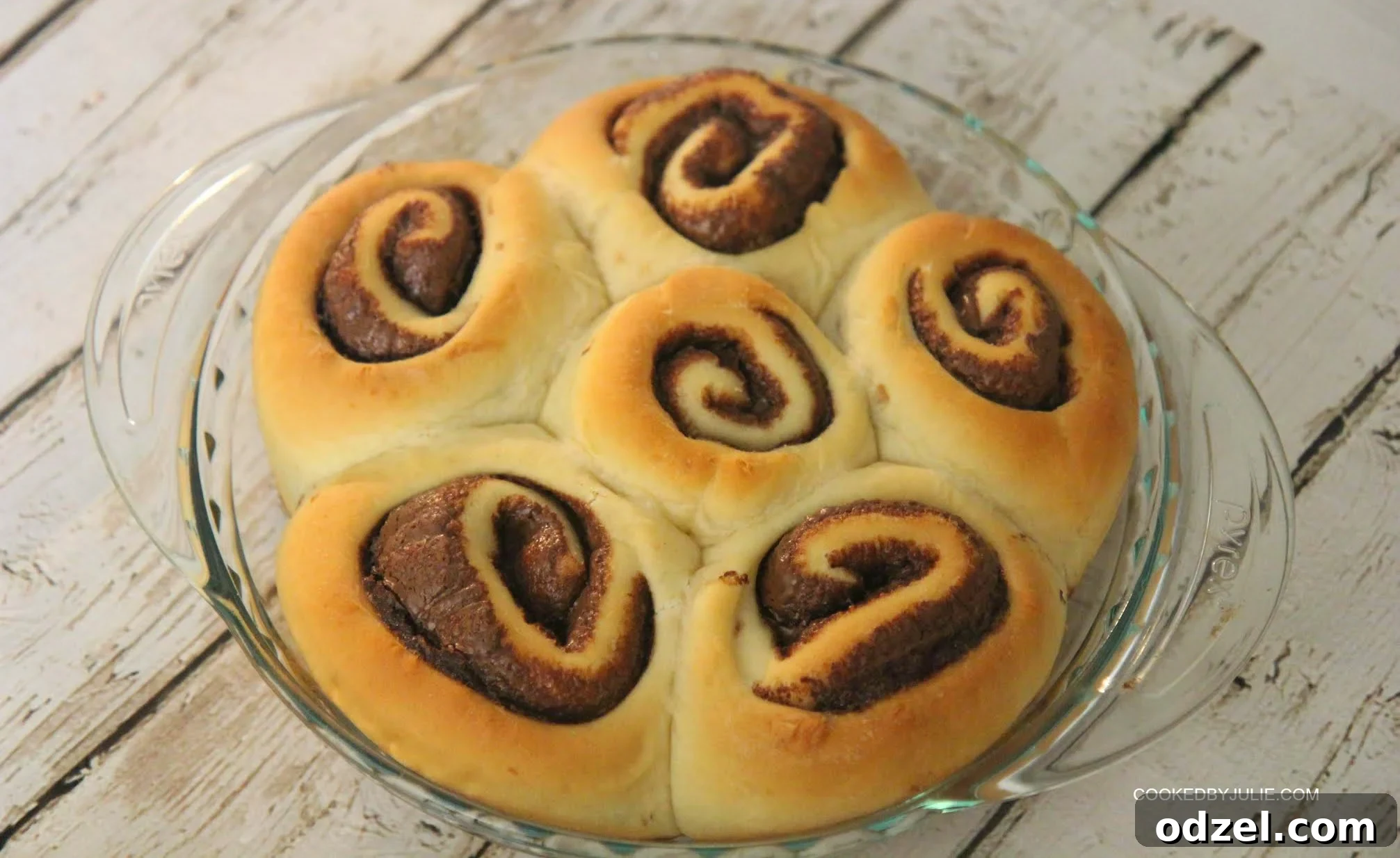 Nutella Swirl Cinnamon Rolls From Scratch 4 These Nutella cinnamon rolls are perfect for a weekend breakfast, served alongside a refreshing cold glass of milk