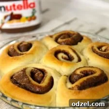 Nutella Swirl Cinnamon Rolls From Scratch 5 Homemade Nutella Cinnamon Rolls with cream cheese frosting