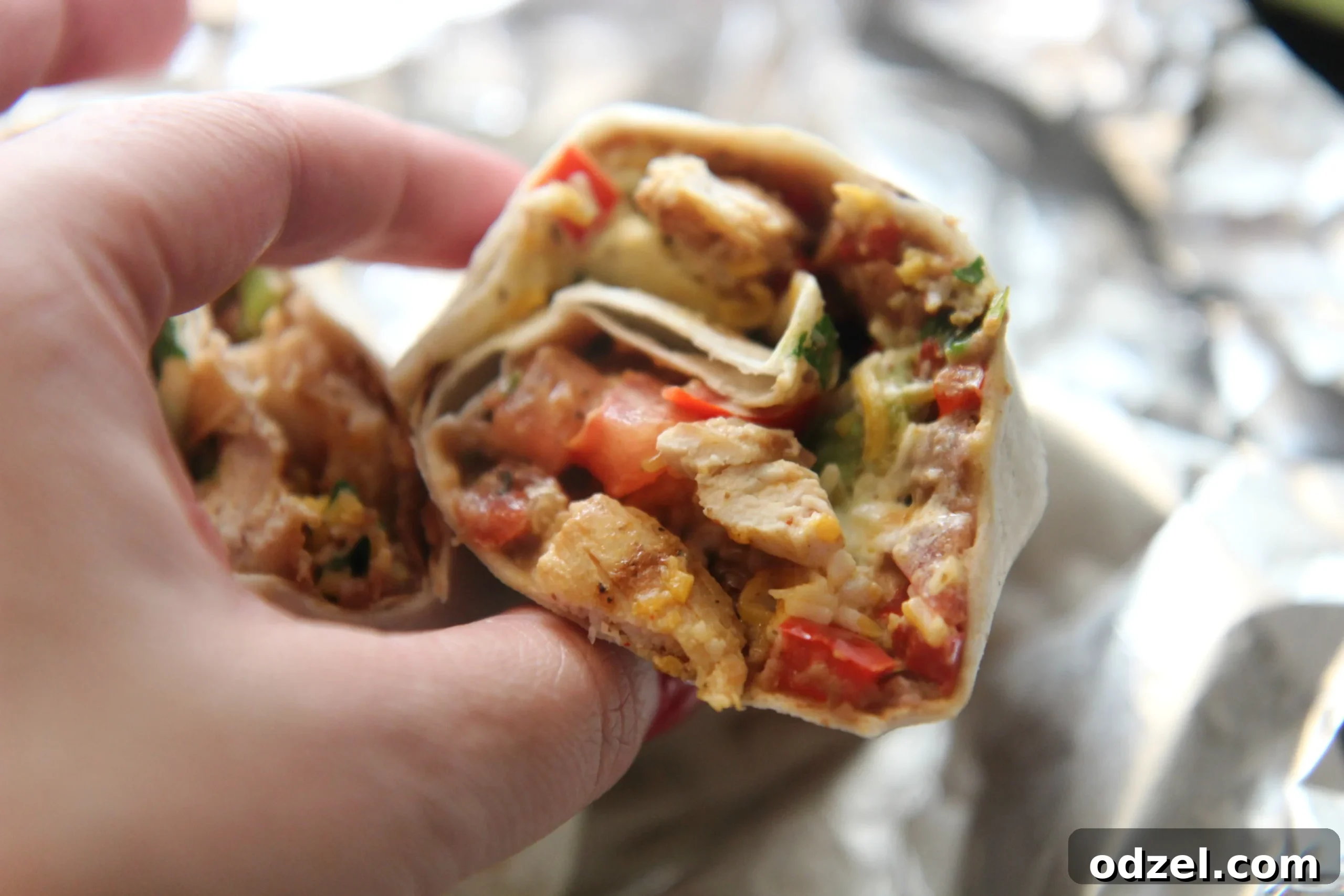 Signature Grilled Tex-Mex Chicken Burrito 3 Served with sour cream and hot sauce, this Tex-Mex burrito is the perfect lunch.