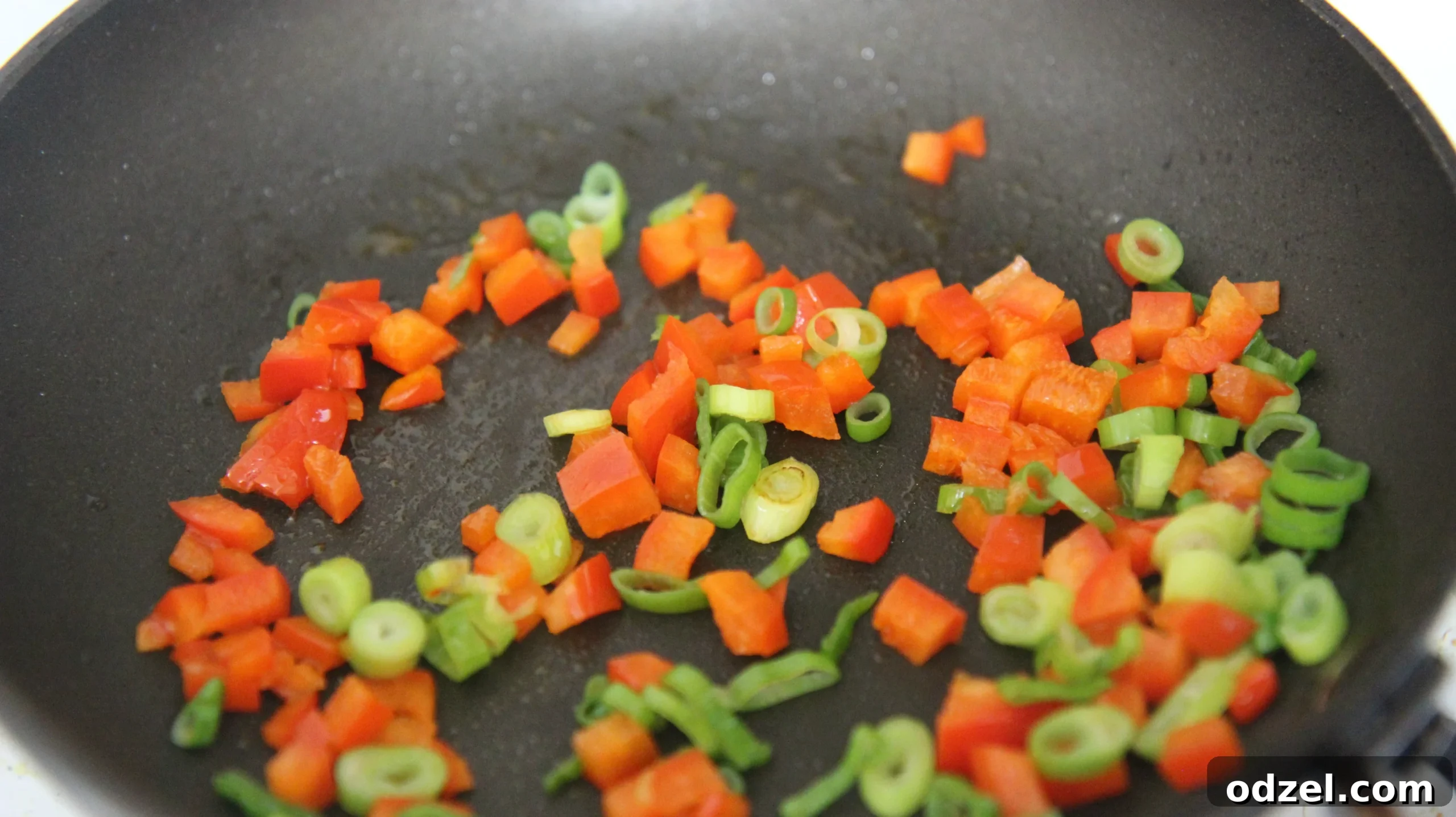 Signature Grilled Tex-Mex Chicken Burrito 4 Saute chopped red bell peppers and green onions in a pan.