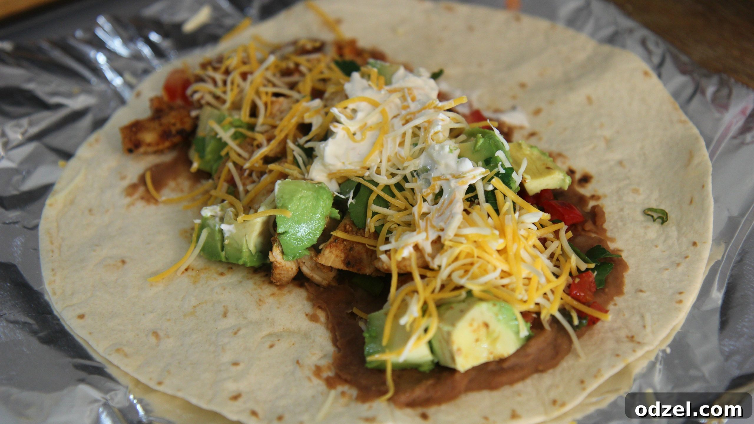 Signature Grilled Tex-Mex Chicken Burrito 7 Top this tex-mex burrito with cheese and sour cream.