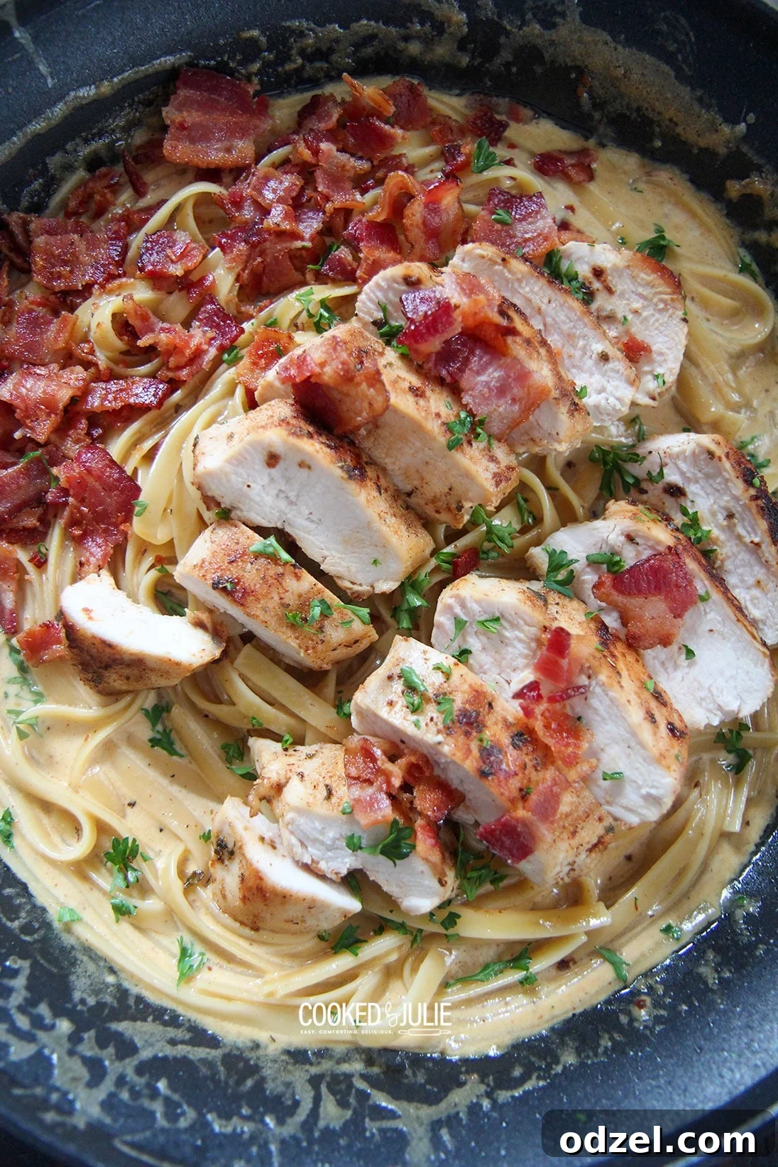 A large skillet filled with creamy pasta, ready to be served, highlighting the delicious texture.