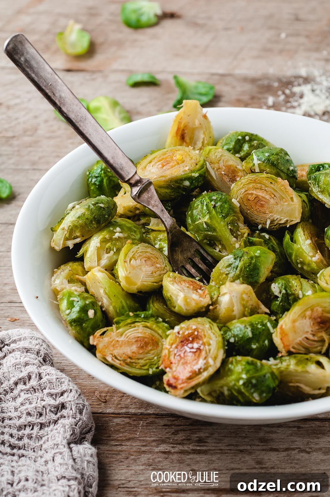 roasted parmesan Brussel sprouts in a white bowl