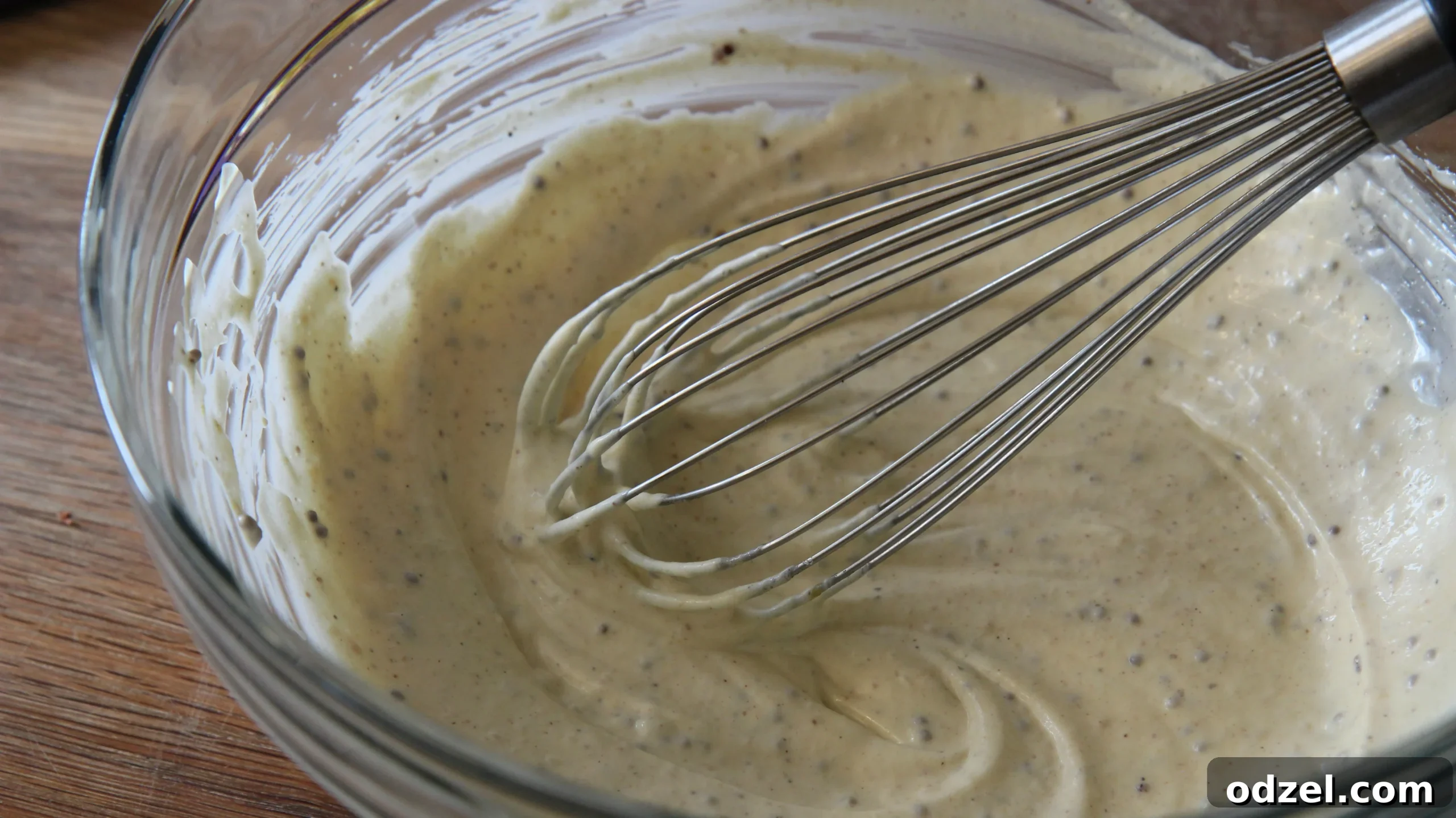 Whisking together the creamy mayonnaise-based sauce for the macaroni chicken salad.