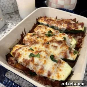 Lasagna stuffed zucchini boats with meat sauce and melted mozzarella.