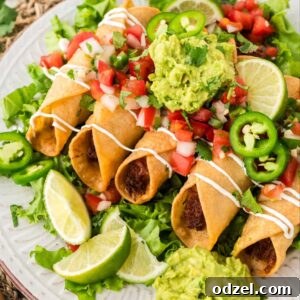 Chicken flautas on a plate with guacamole, pico de Gallo, jalapeños, and lime wedges,